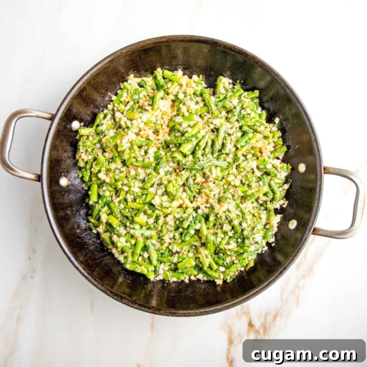 Skillet with green asparagus and herbs plus cauliflower rice.