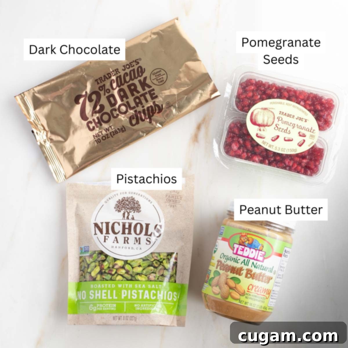 Labeled ingredients in packages: chocolate chips, pomegranate seeds, pistachios and peanut butter. 