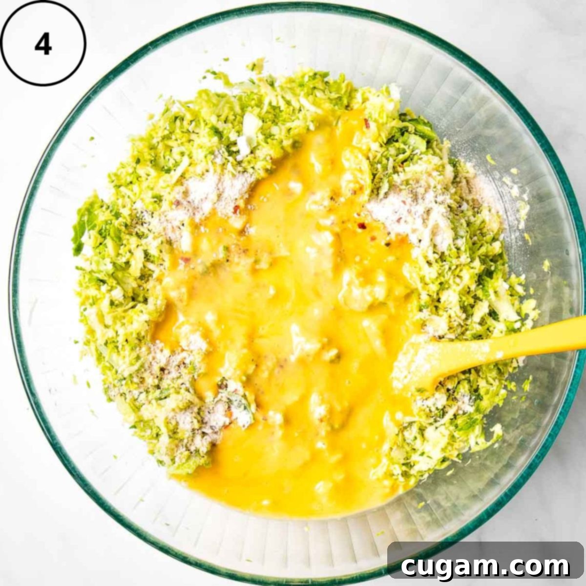 Shredded veggies plus oat flour topped with scrambled raw eggs.
