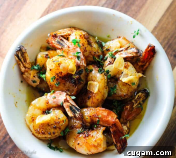 Succulent Grilled Shrimp, perfectly charred and tossed in a rich garlic sauce, ready to be enjoyed.