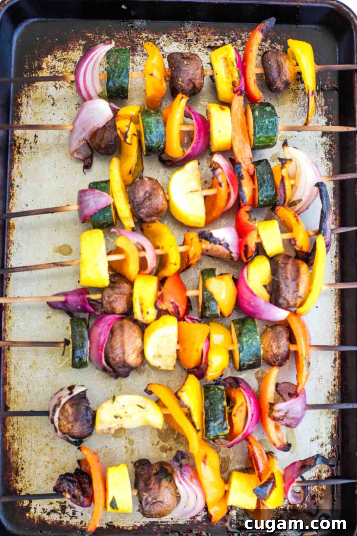 Mediterranean Harvest Skewers 10 Grilled vegetable skewers on a sheet pan.