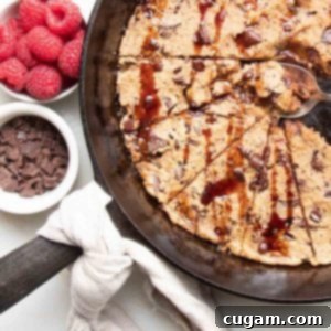 Delicious Vegan Gluten-Free Chocolate Chunk Skillet Cookie 13 Vegan Chocolate Chunk Skillet Cookie with date syrup and raspberries