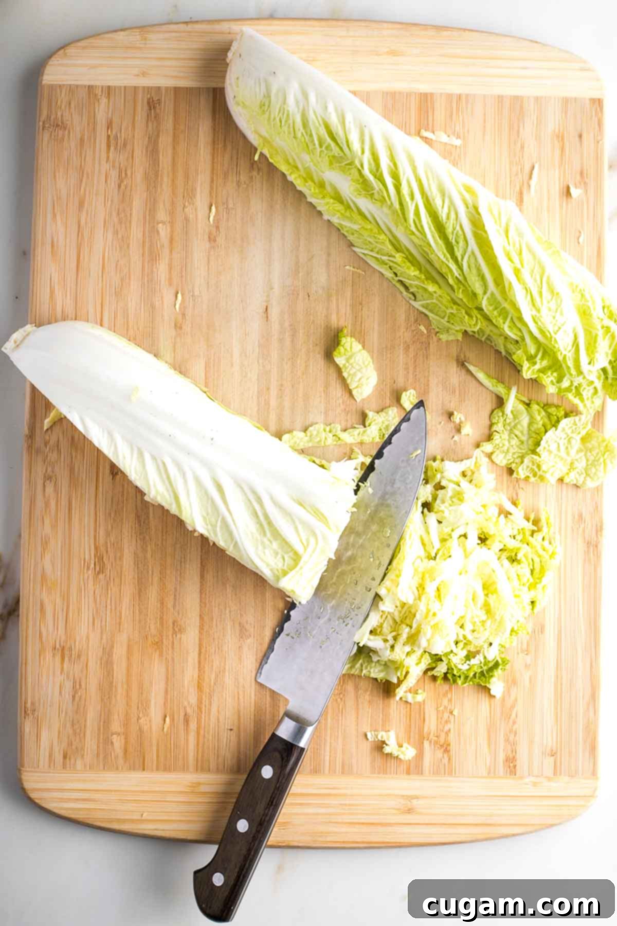 Napa cabbage cut lengthwise into quarters and then thinly sliced. 