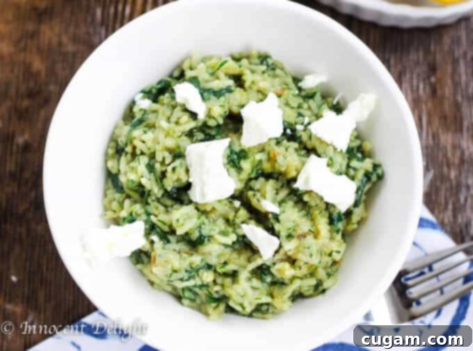 Greek Spinach Rice with Feta is a flavorful and light side dish, perfect with chicken.