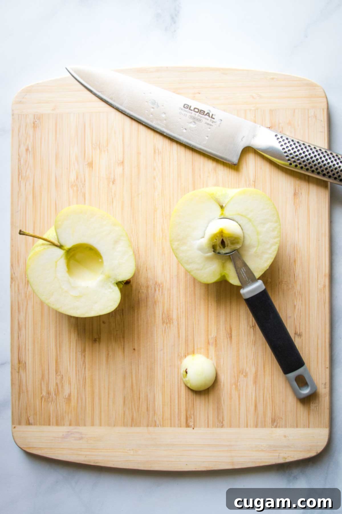 Green apple, halved and then the inner core scooped out with a melon baller.