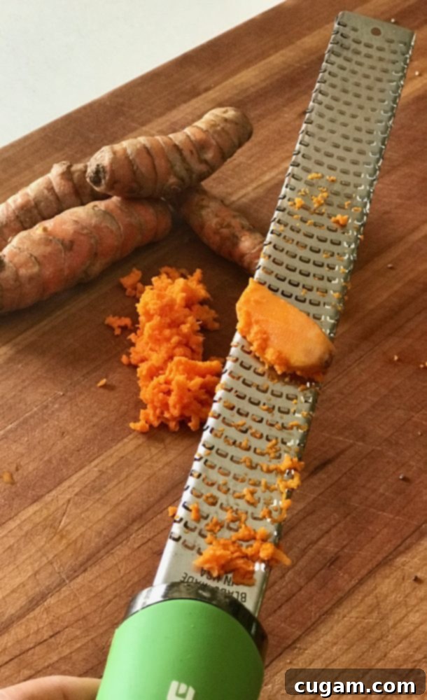 Fresh Turmeric is grated and added to golden milk for vibrant color and health benefits