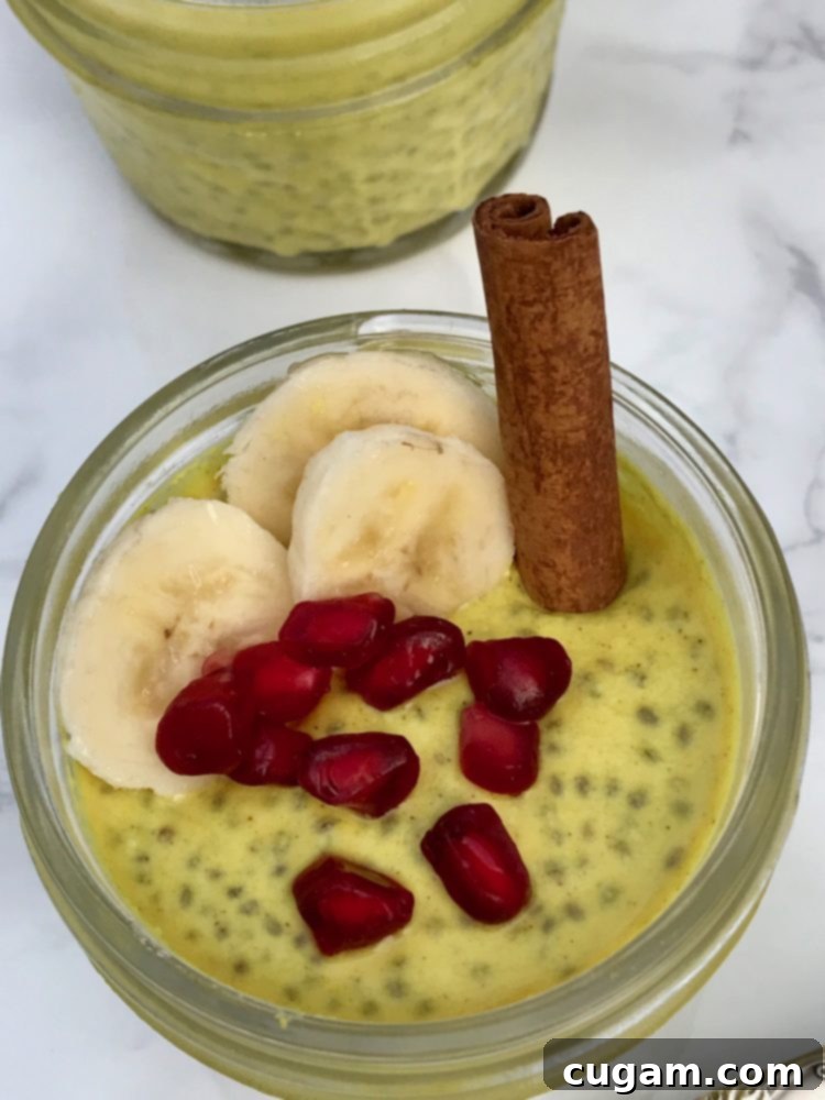 Golden Chia Pudding topped with vibrant pomegranate seeds