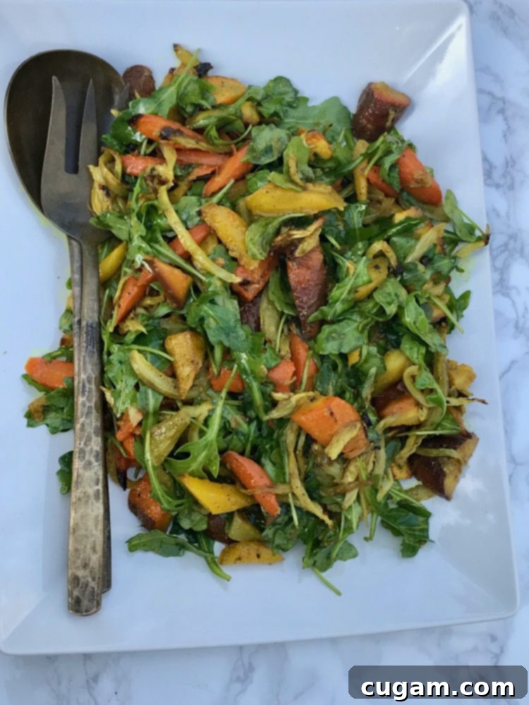 A vibrant and beautifully plated Roasted Carrot and Fennel Salad, perfect for an autumn meal