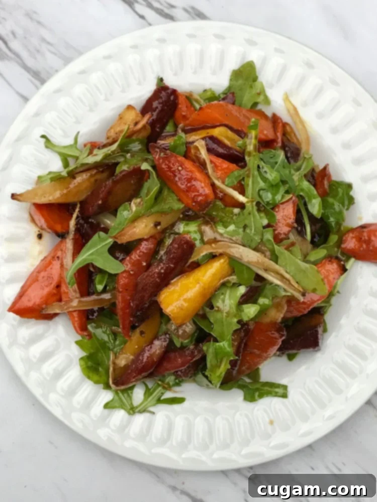 A rustic bowl of roasted carrot and fennel salad with fresh greens, ready to be enjoyed