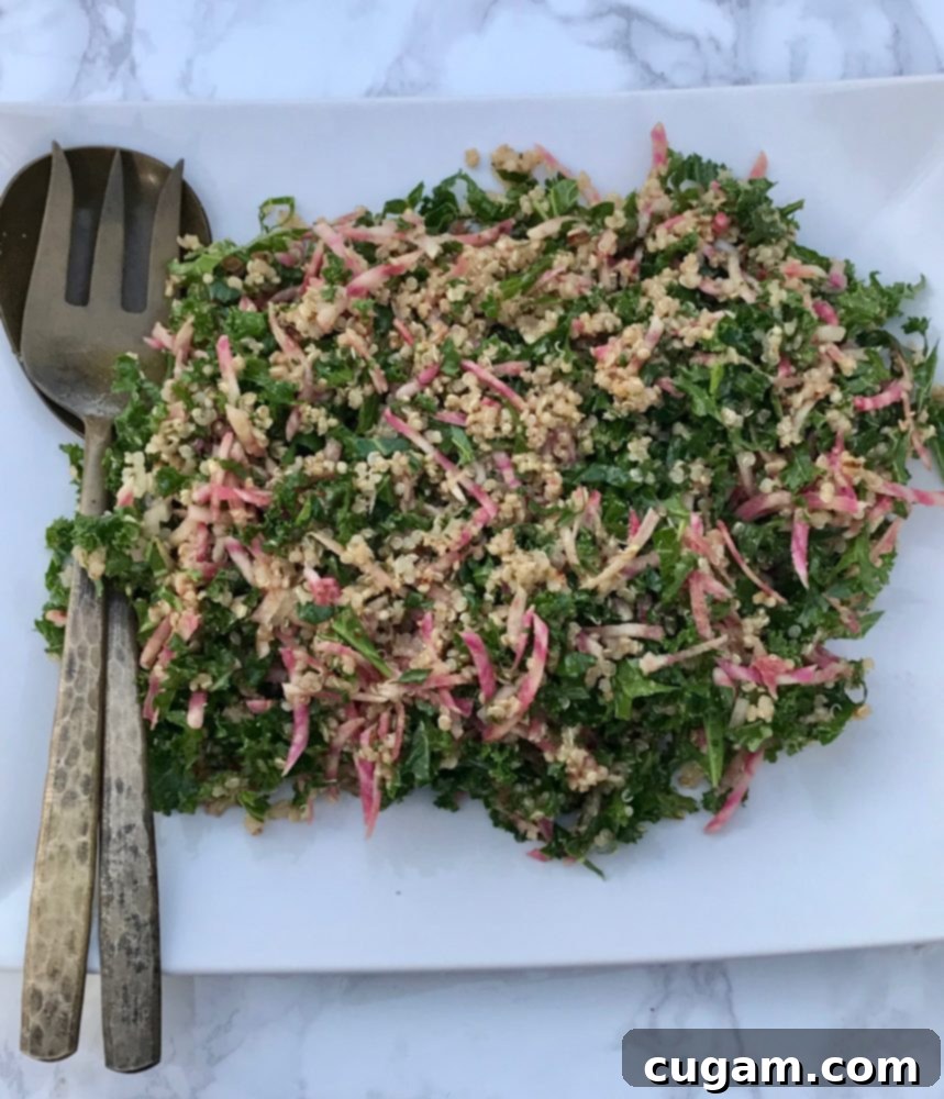 Vibrant kale salad loaded with colorful beets and protein-rich quinoa, perfect for a healthy meal.