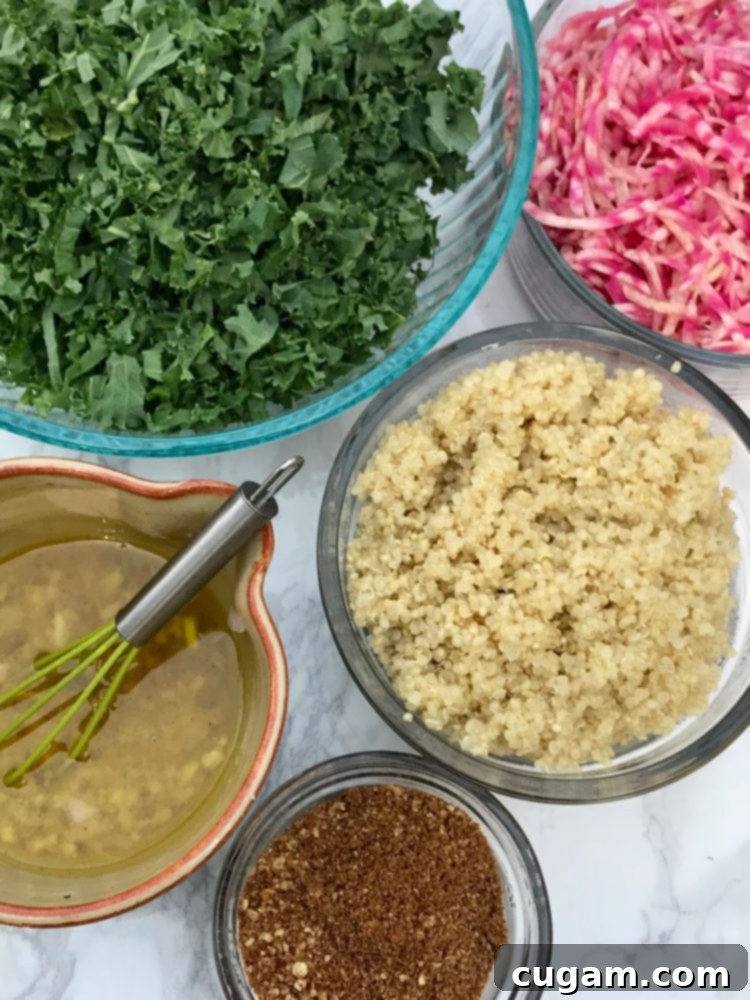 Close-up of massaged kale leaves, showing their tender and silky texture in a salad with beets and quinoa.
