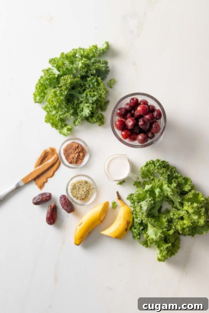 A vibrant green smoothie in a glass, made with greens, banana, dates, cherries, and almond butter, looking deceptively like a chocolate shake.