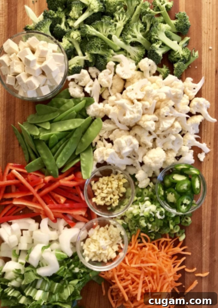 Simple Miso Soup ingredients laid out, highlighting fresh vegetables like broccoli, cauliflower, carrots, and bell pepper.