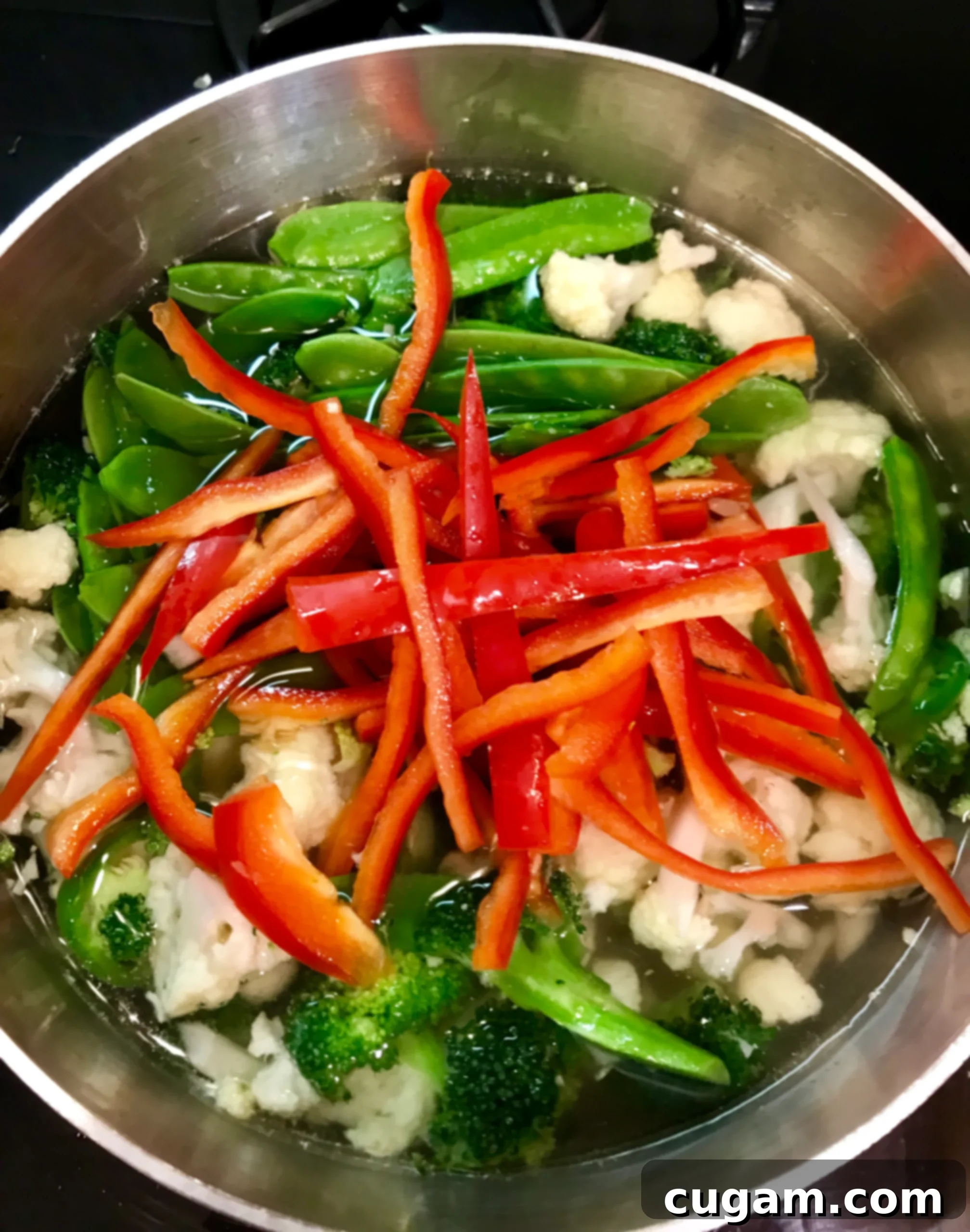 Simple Miso Soup with a variety of colorful vegetables in a pot.