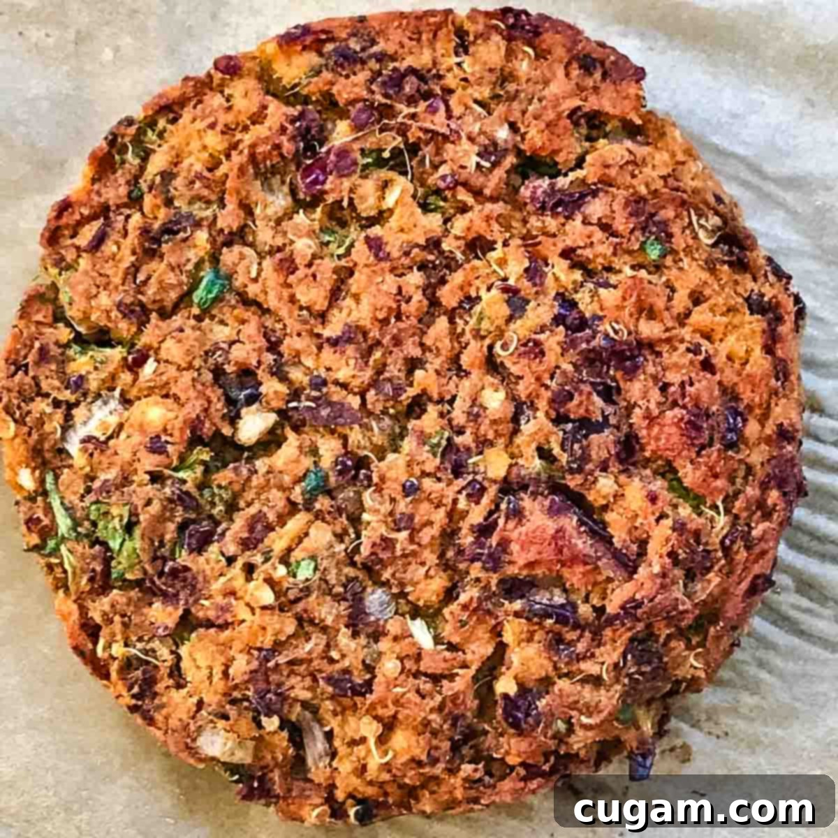 Close up of a sweet potato and black bean burger that's been cooked.