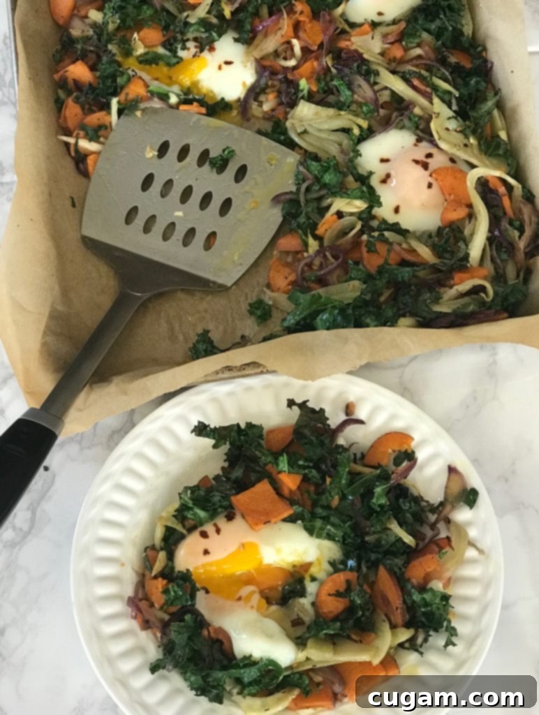 Eggs and veggies cooked on a sheet pan lined with parchment paper. 