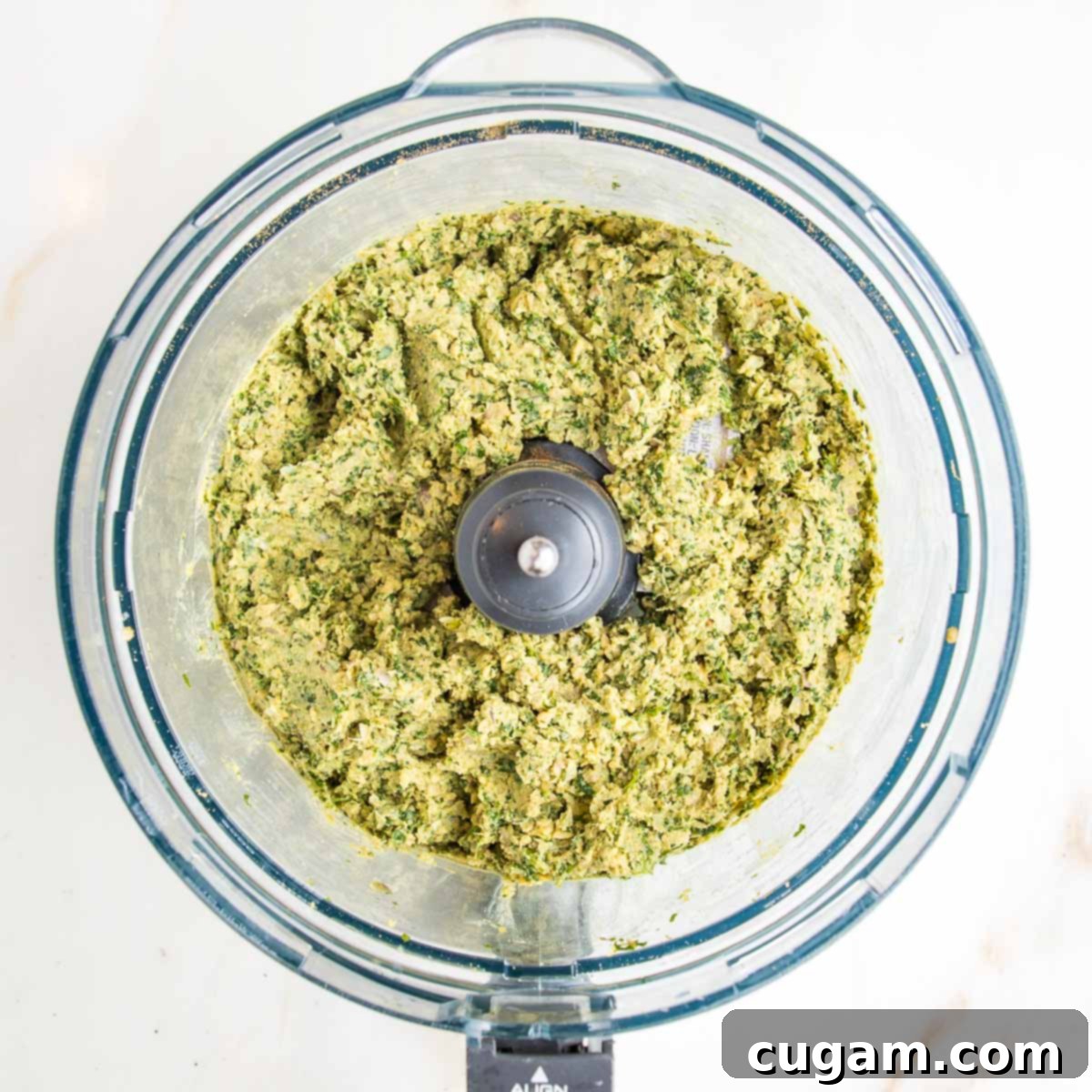 Ground herbs, seeds, chickpeas and tahini for falafel balls.