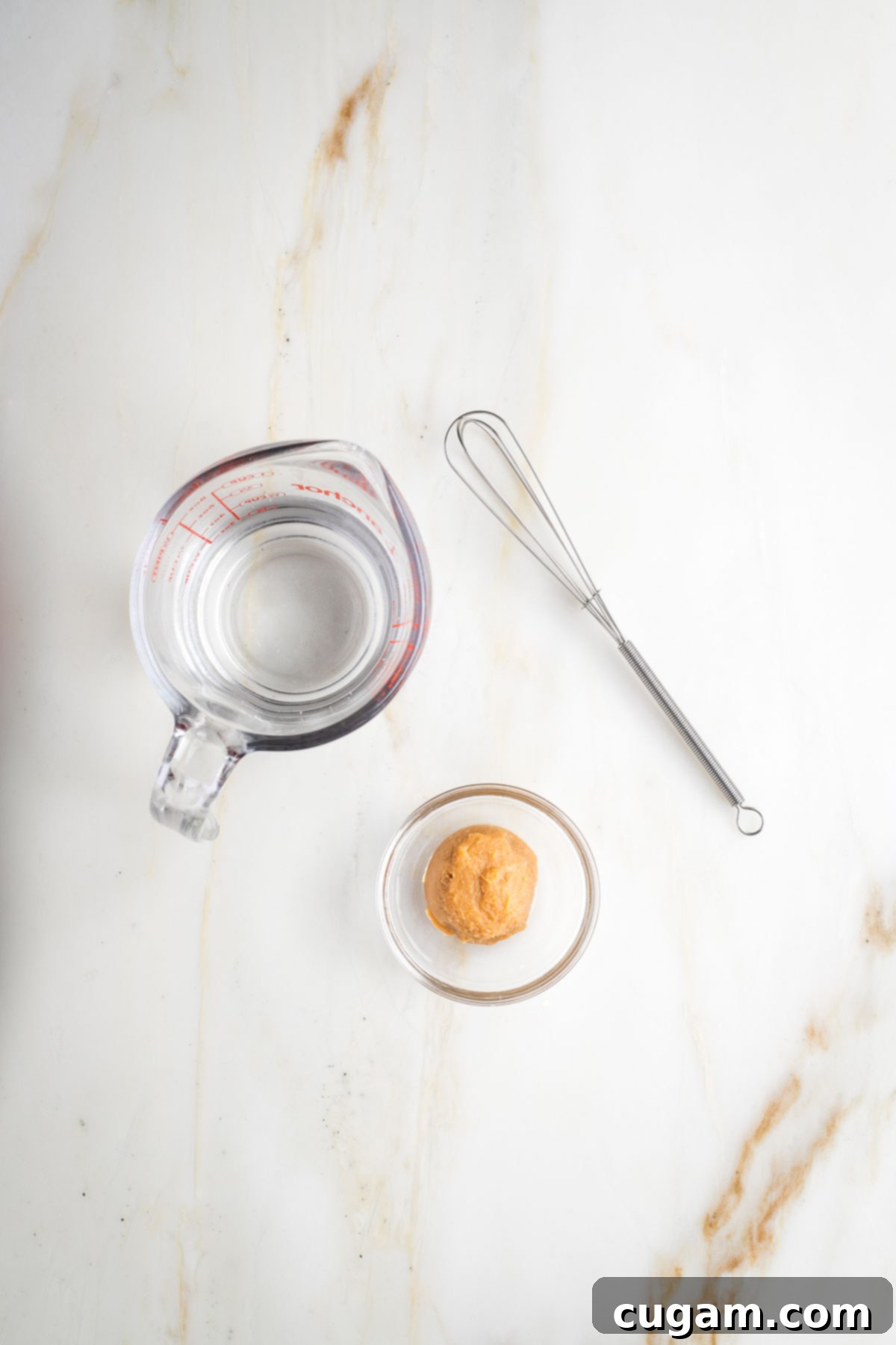 1 cup glass measuring cup, 1 tablespoon miso plus a small whisk.