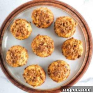 Round plate filled with carrot muffins with walnuts, raisins and shredded carrots.