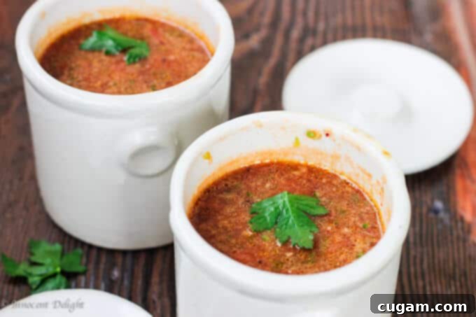 Ingredients for a fresh Gazpacho recipe: tomatoes, peppers, cucumbers, and onion