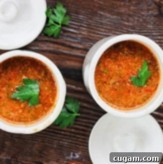 Bright and Zesty Summer Gazpacho 7 Refreshing Summer Gazpacho in a clear bowl, ready to serve