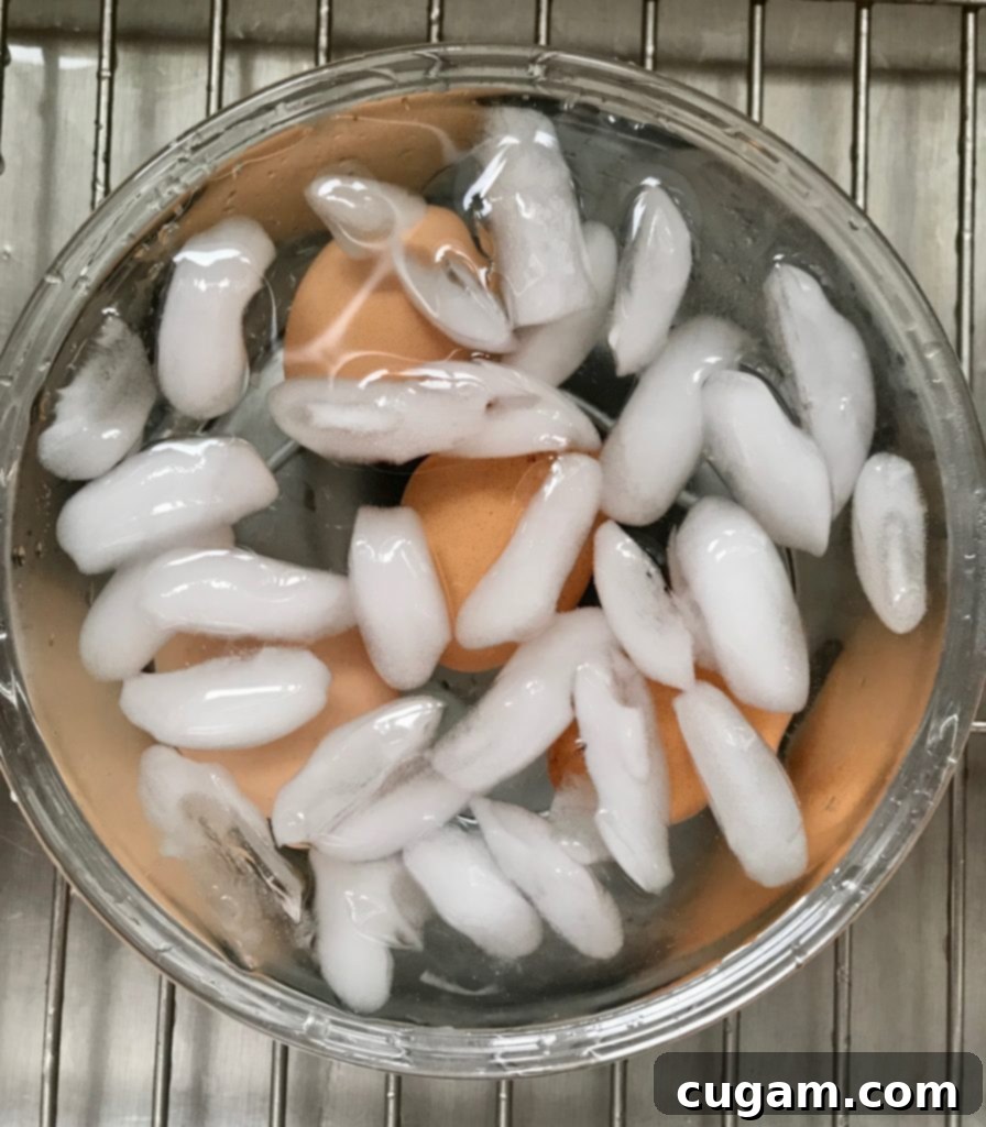 Quick & Easy Spinach Salad 3 Cool boiled eggs in ice water.