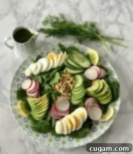 Quick & Easy Spinach Salad 9 Sliced boiled eggs, avocado, cucumbers, and pine nuts on a bed of spinach