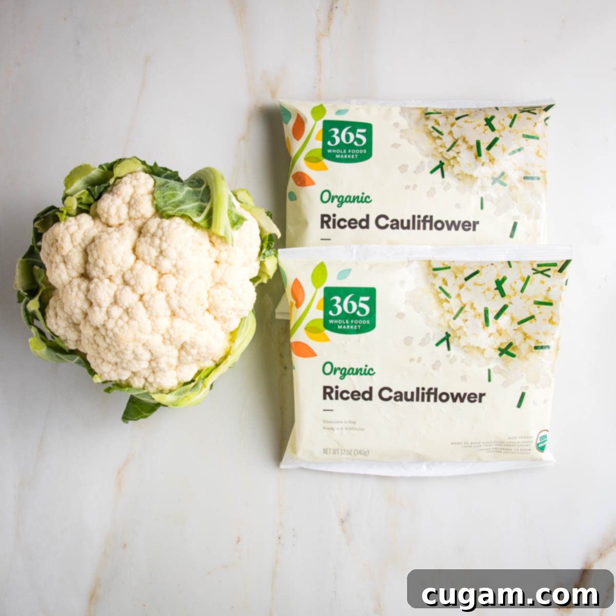 Effortless Stovetop Cauliflower Rice 3 A head of cauliflower and 2 packages of 365 brand organic riced cauliflower.