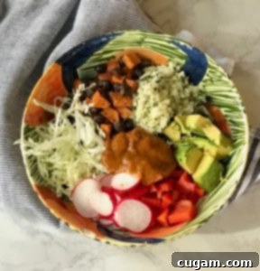 A vibrant and fully loaded Vegan Enchilada Bowl ready to be enjoyed.
