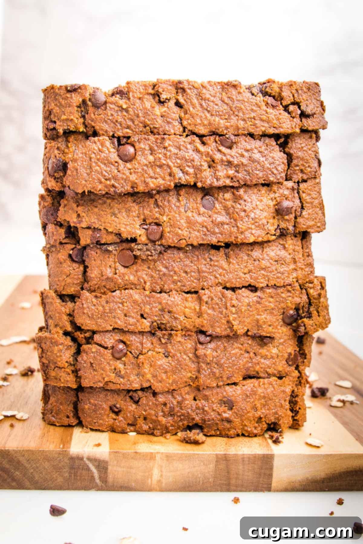Stack of thick slices of banana bread with chocolate chips.