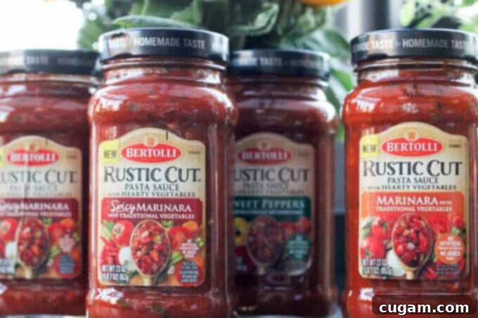 A Bertolli Rustic Cut Marinara Pasta Sauce jar displayed, showcasing its rich texture and wholesome ingredients, perfect for easy, authentic Italian meals. #Ad #ReachforRustic