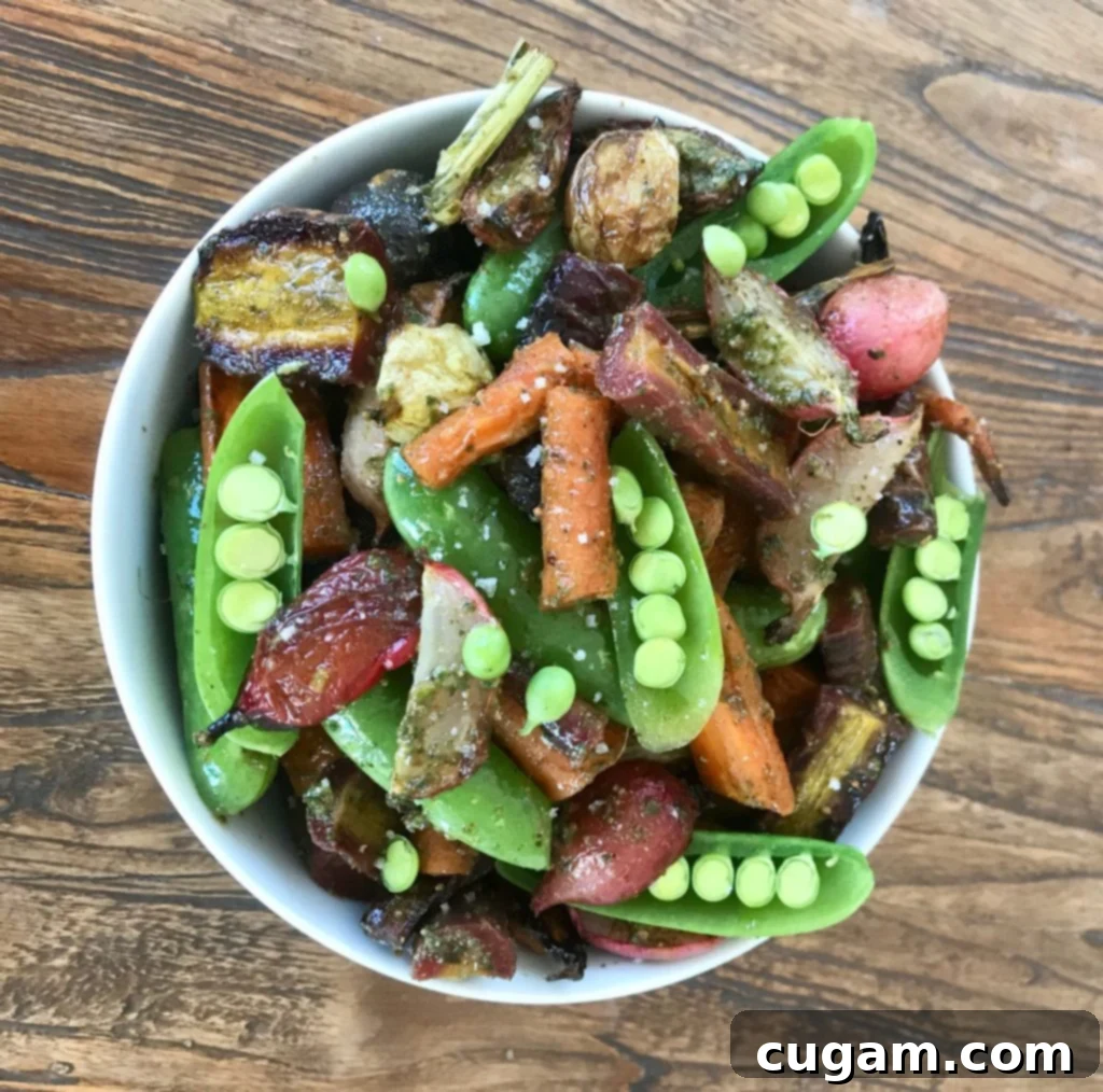 Crisp snap peas, vibrant carrots, and fresh radishes artfully arranged in a white bowl, ready to be tossed with pesto.
