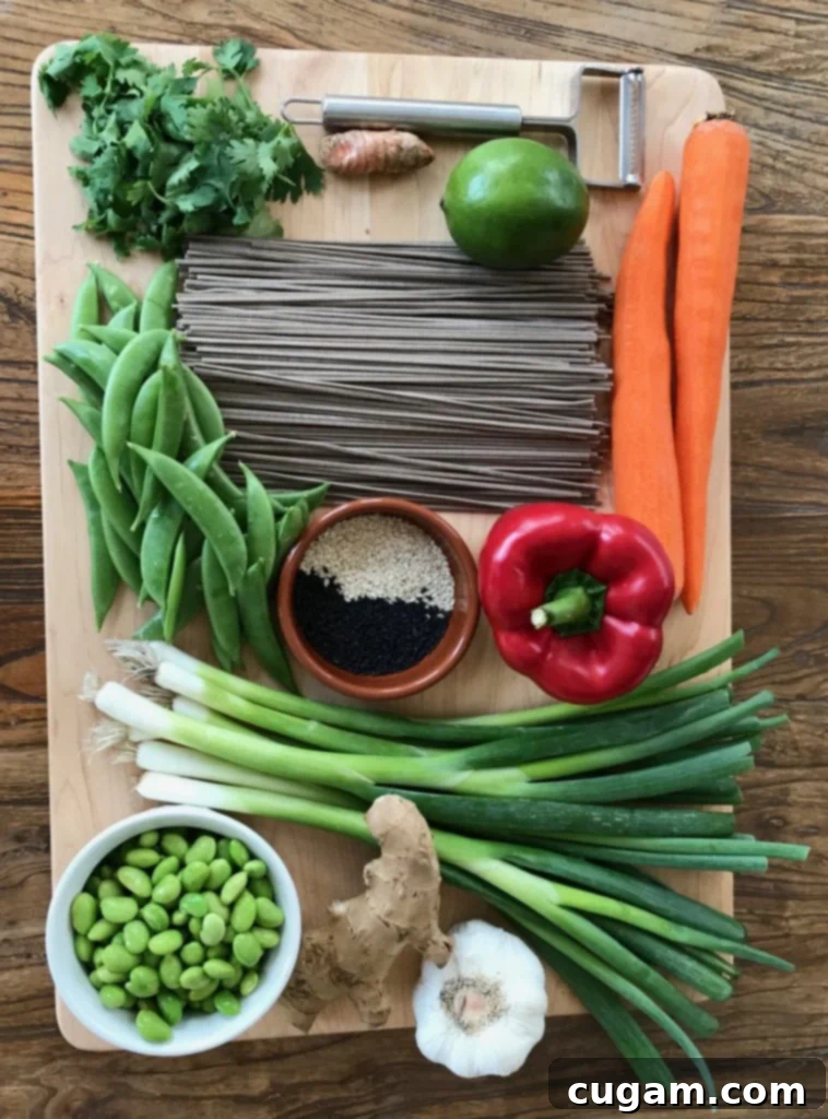 Soba noodles, cilantro, carrots, red pepper, scallions, edamame, garlic, snap peas, sesame seeds, turneric