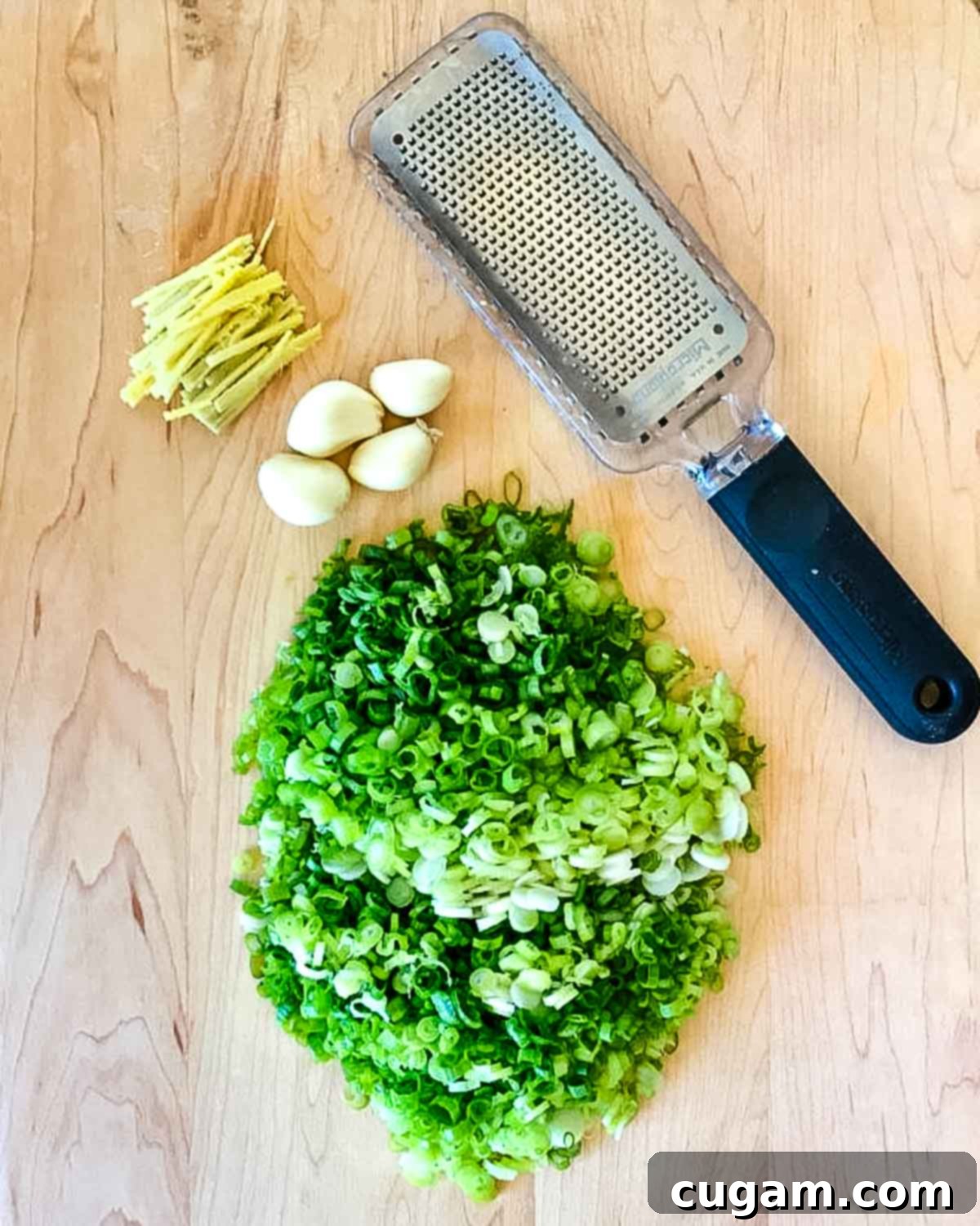 Aromatic Ginger Scallion Bok Choy 3 Thinly sliced scallions, cloves of garlic and pieces of ginger plus a microplane grater.