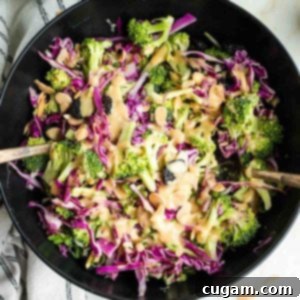 Crisp Raw Broccoli Salad with Miso Dressing 14 Chunks of raw broccoli and cabbage with a miso dressing, topped with scallions, almonds and dried cherries.