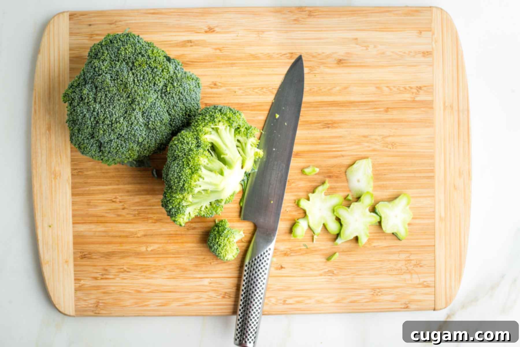 Crisp Raw Broccoli Salad with Miso Dressing 7 Trimming stems off broccoli crowns.