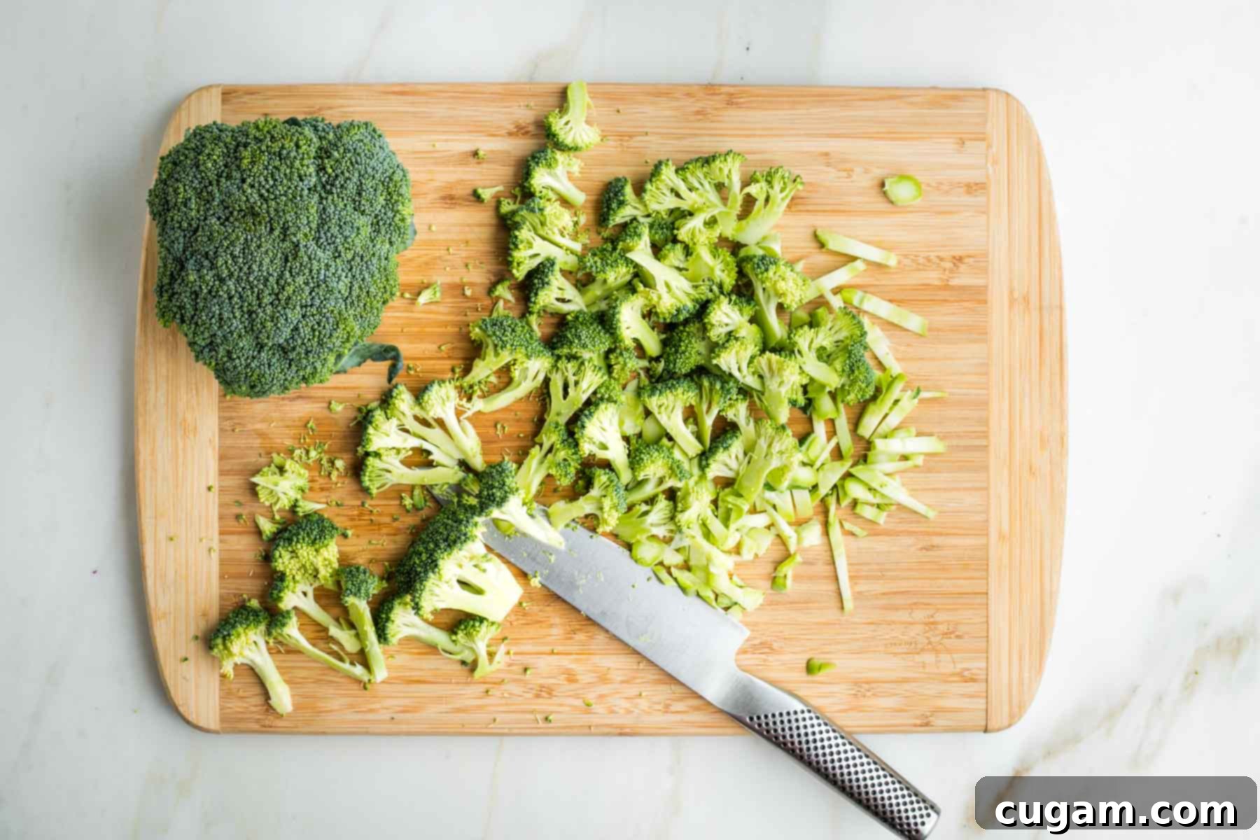 Crisp Raw Broccoli Salad with Miso Dressing 8 Trimming broccoli stalks into florets and pieces of the stems.