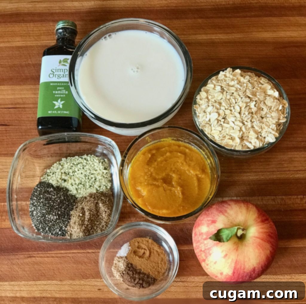 Autumn Spiced Overnight Oats 3 Overhead shot of wholesome ingredients for pumpkin overnight oats including pumpkin puree, oats, and spices.