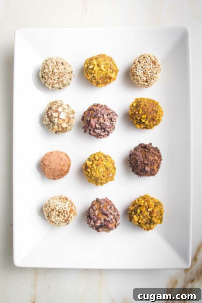 White rectangular plate with pumpkin balls that have individually been rolled in crushed nuts or seeds.