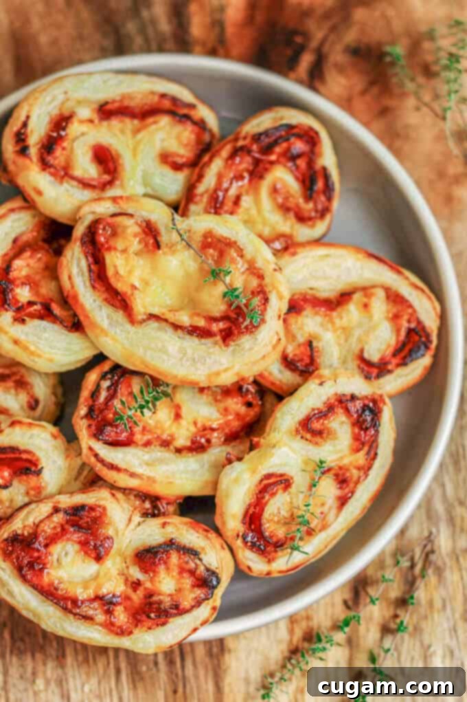 Delicious Mahon-Menorca Pinwheels with Fig Jam and Serrano Ham, perfect for any gathering or Thanksgiving appetizer.