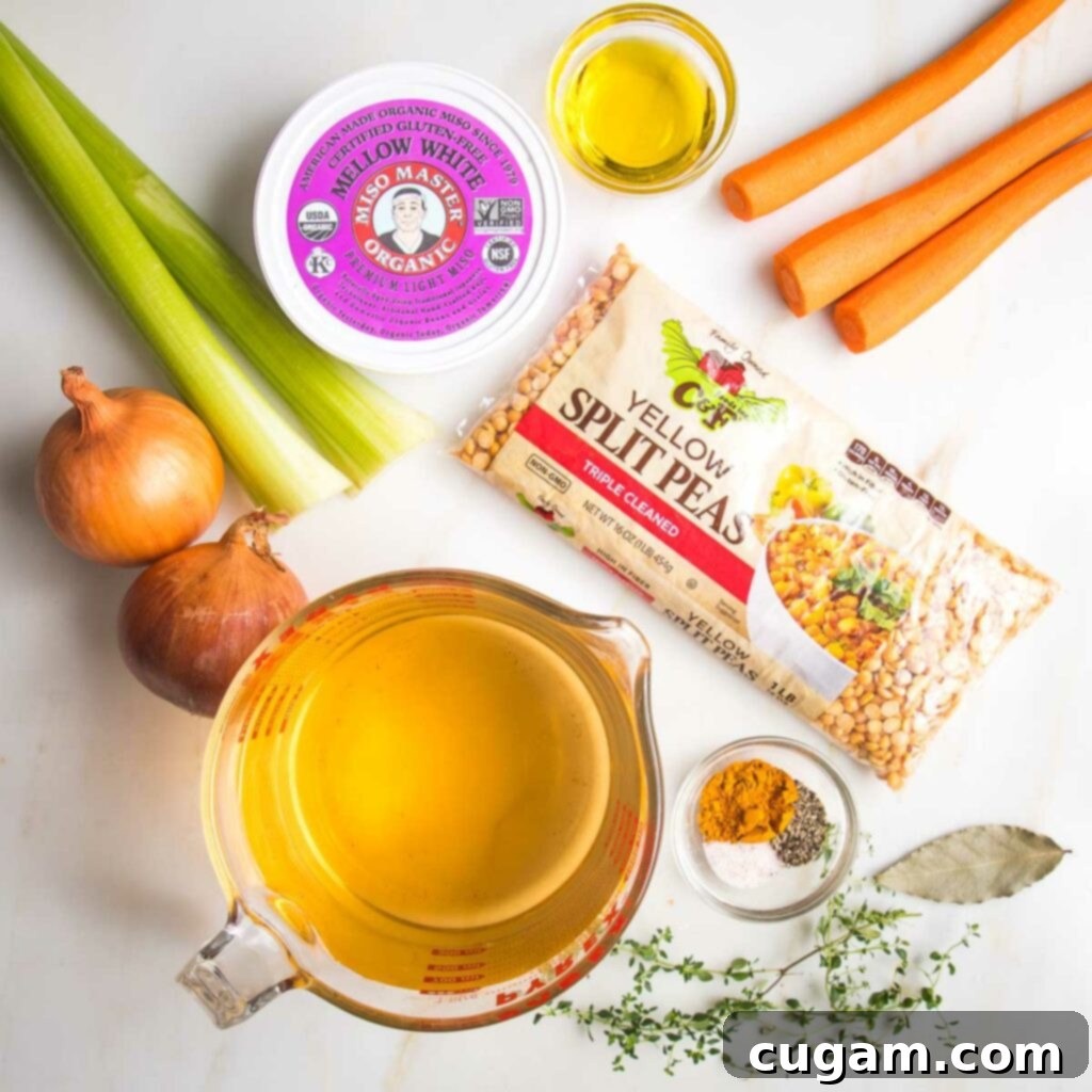 Ingredients for yellow split pea soup:  bag of dried yellow split peas, container of light miso paste, 2 stalks of celery, 3 large carrots, 2 onions, dish of spices, fresh thyme, bay leaf and 4 cups of veggie stock.