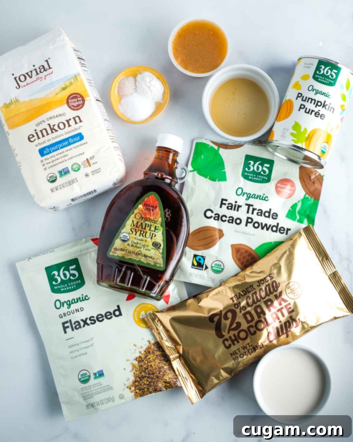 Ingredients for double chocolate muffins: flour, maple syrup, applesauce, vinegar, cacao, flaxseeds, pumpkin puree, almond milk. 