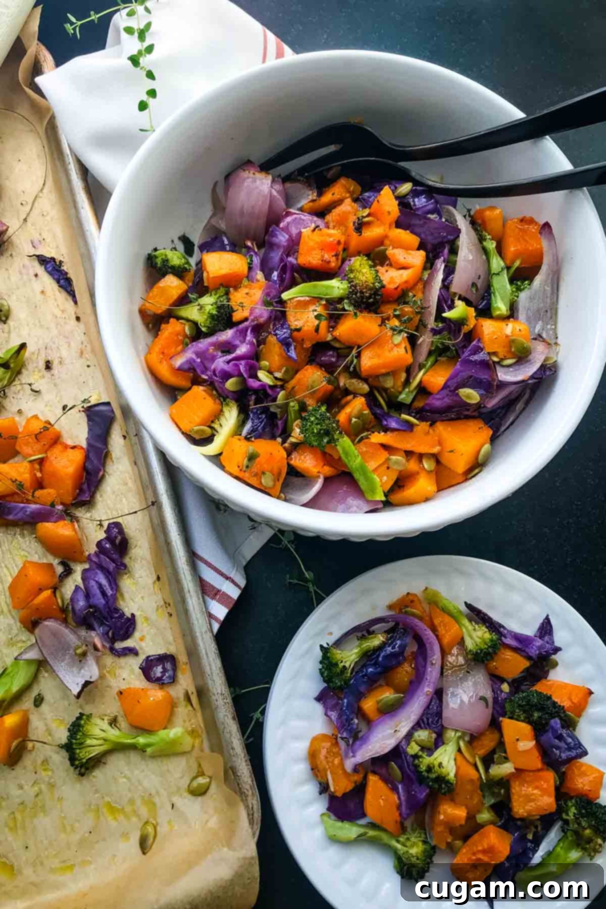 Butternut squash, broccoli, onion and cabbage roasted on a sheet pan and transferred to a bowl. A beautifully arranged bowl of roasted autumn vegetables.