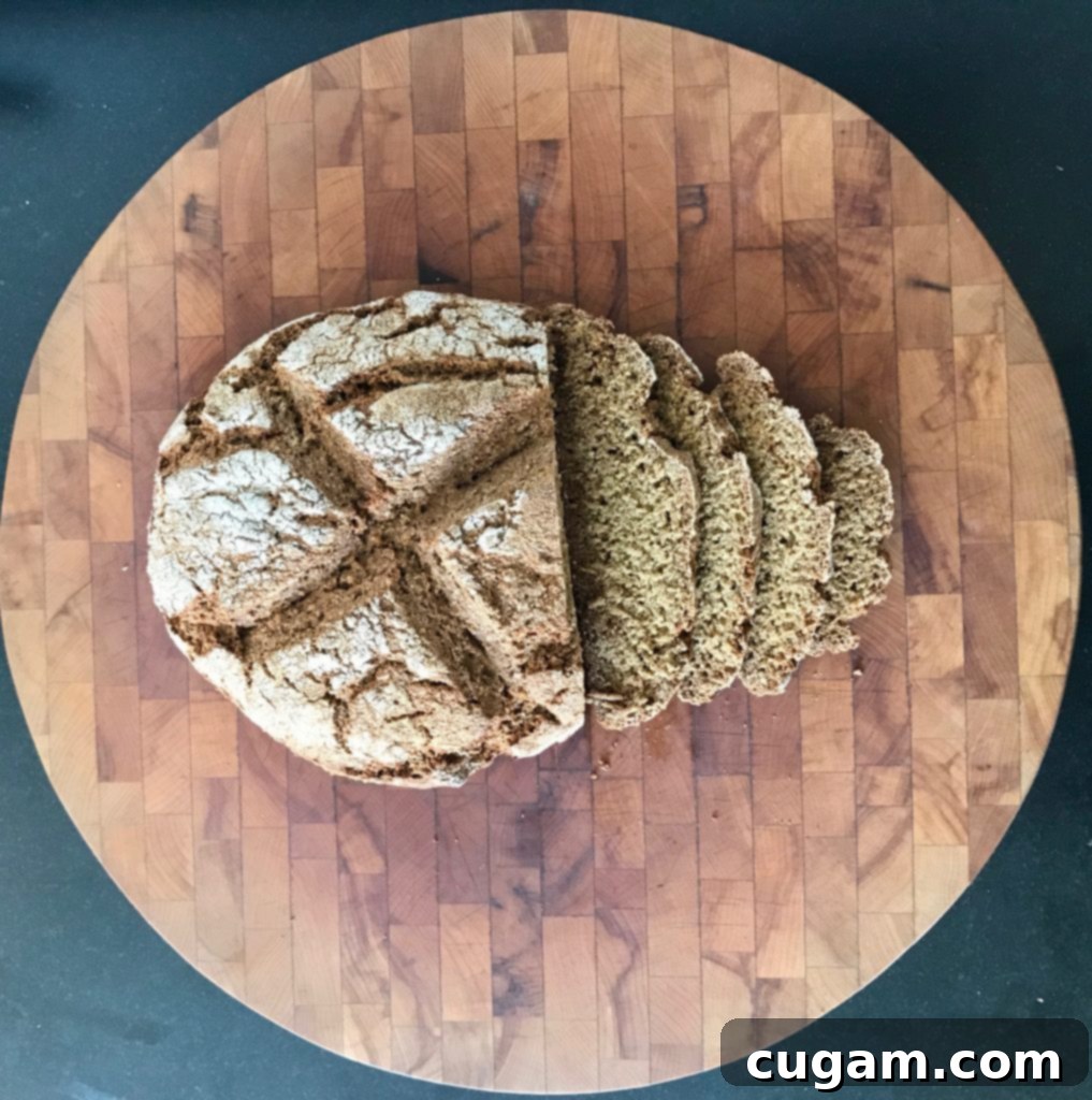 Close-up of a sliced loaf of Whole Grain Irish Soda Bread, showing its wholesome texture