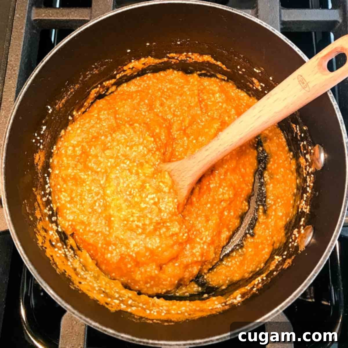 Sauce pan filled with thick orange and chia mixture.