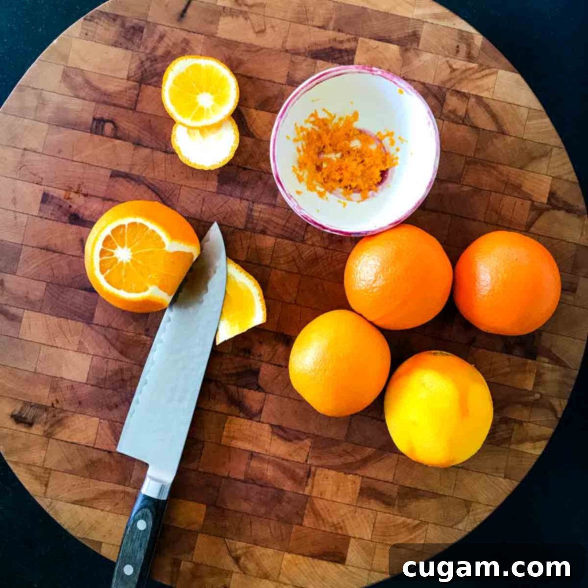 Cutting a slice of peel off an orange.
