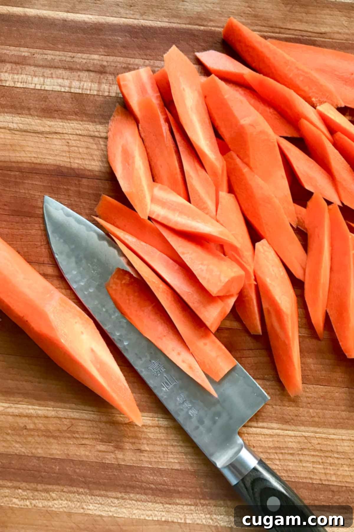 Pile of carrots, cut on the diagonal into spears.