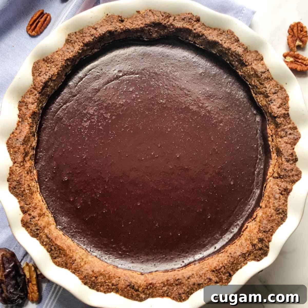 Nut crust and chocolate pudding baked into a pie.