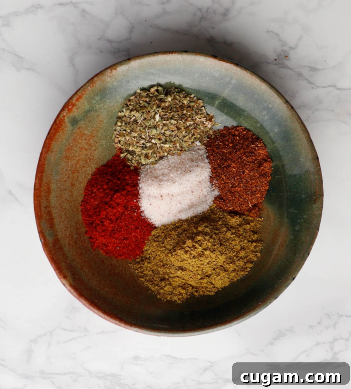 Taco spices: cumin, paprika, chili powder and oregano.
