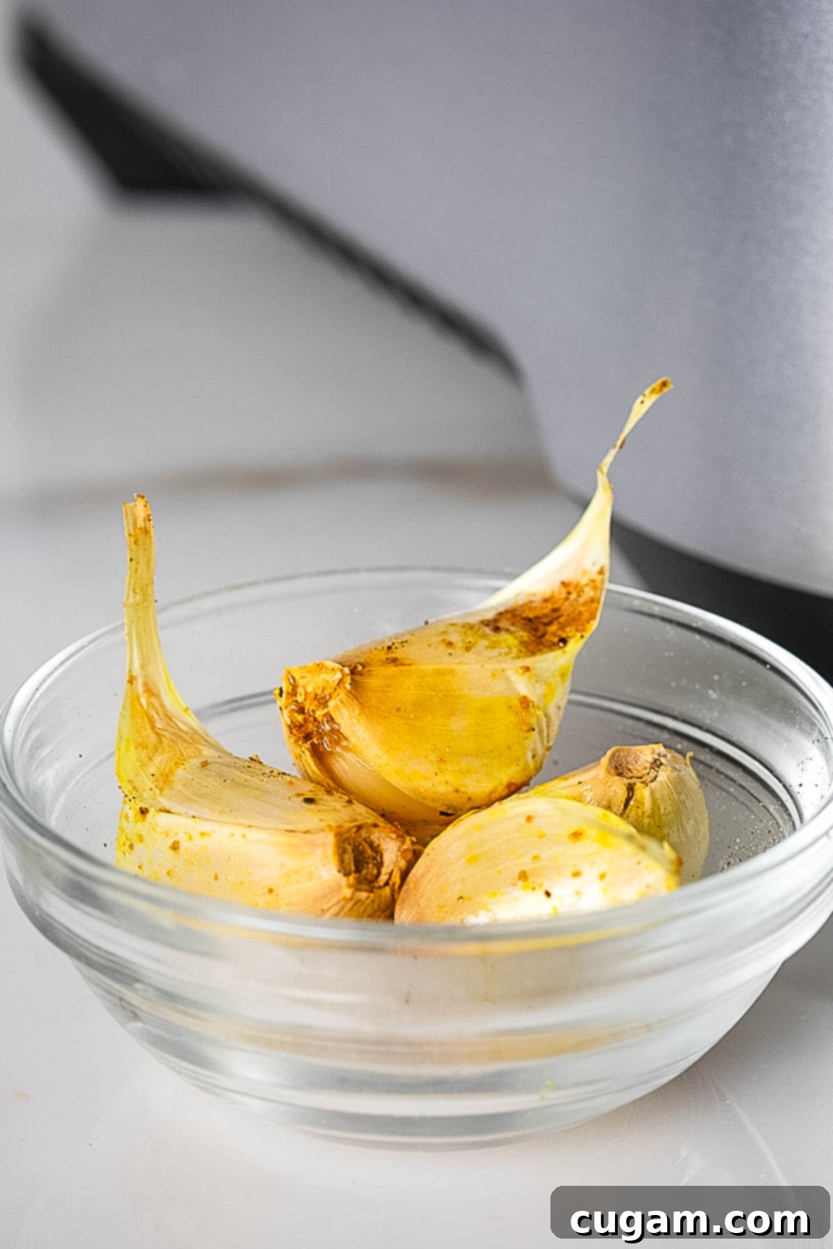Whole roasted cloves of garlic.